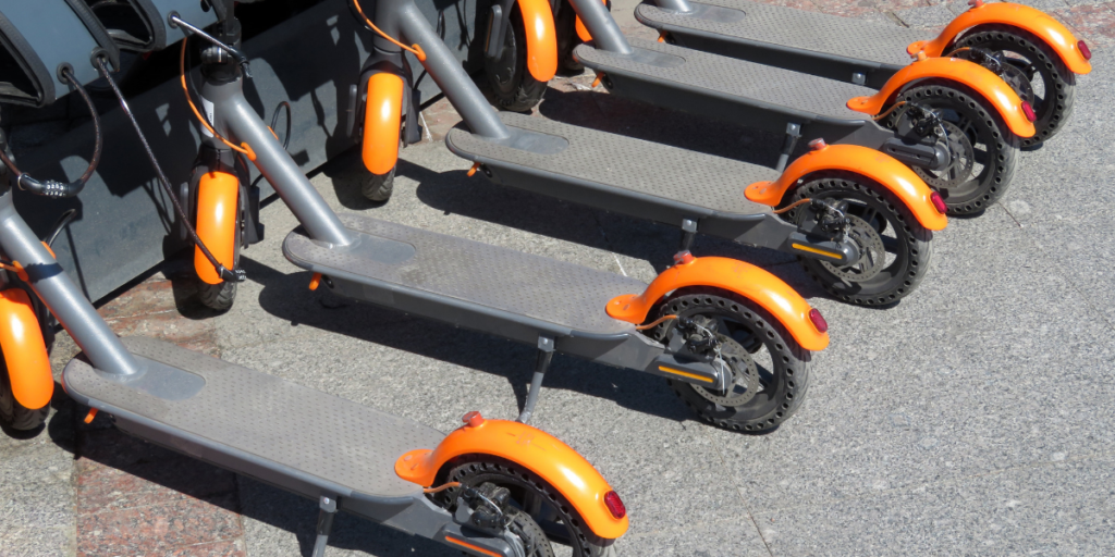 Ride share electric scooters in a dock